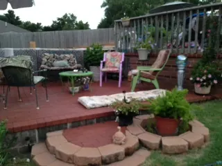 Brick paver patio with a curved border and planters