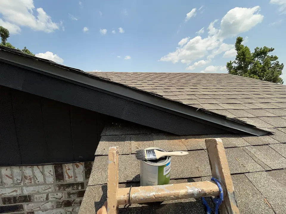 Repaired and painted fascia at the roof edge