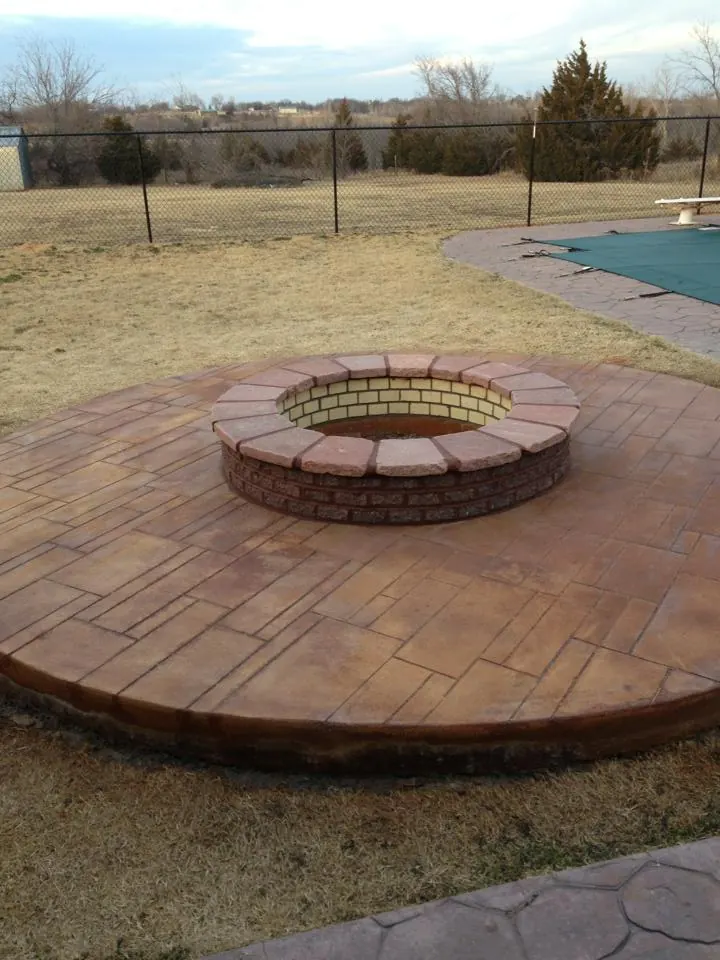 Round brick fire pit in a circular patio built by Jim Cox, mason, JRI Services of Oklahoma City