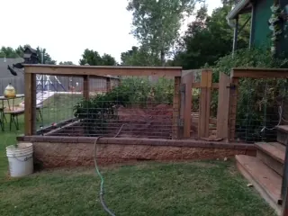 Wood-framed wire garden fence