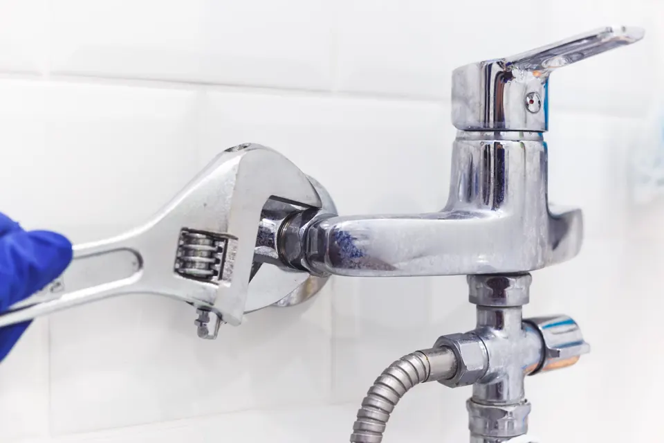 Pipe wrench on a shower fixture