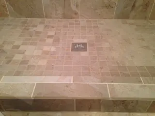 Tiled shower floor with a center drain